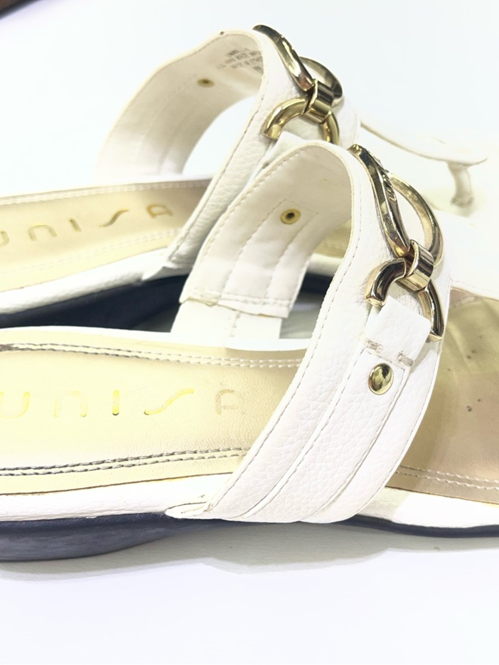 Unisa brand white mules featuring a gold-tone metal detail. - Picture 4 of 6
